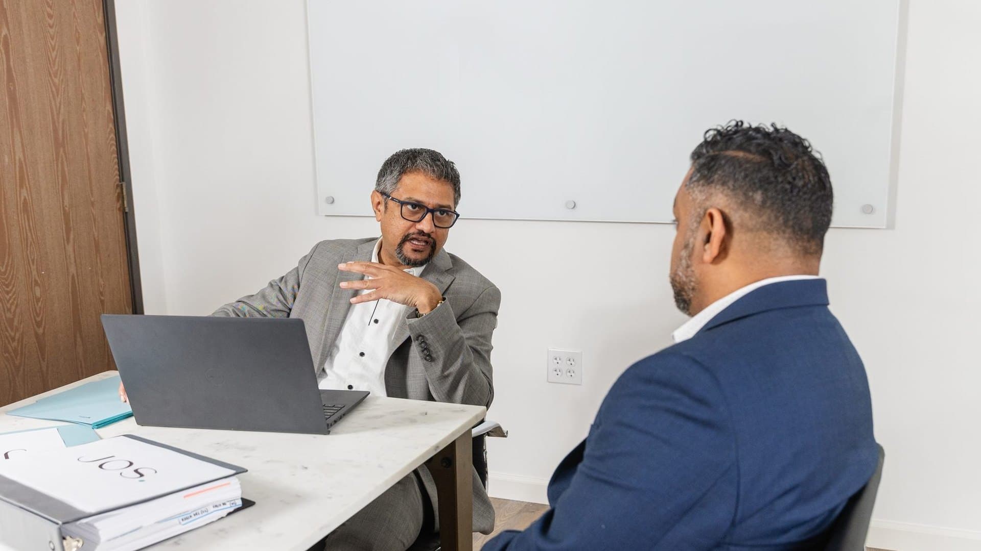 Jos in consultation with a client at the JOS Family Law office in Orange, California